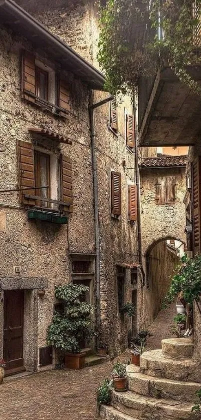 Charming medieval stone alley with rustic buildings and lush greenery.