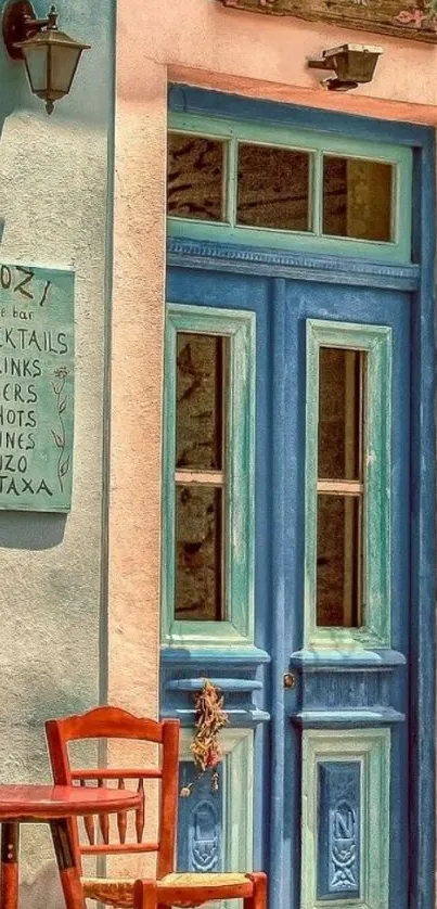 Rustic Mediterranean blue door with wooden chair outside a cafe.