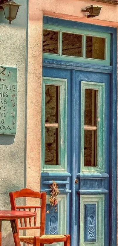 Rustic blue cafe door with wooden chairs.