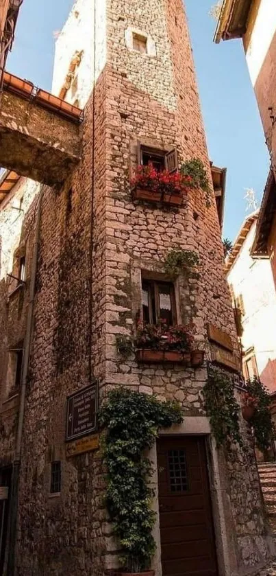 Charming rustic stone tower wallpaper with flowers.