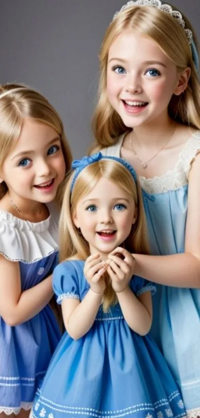 Three smiling children in matching blue dresses, creating a charming and joyful scene.