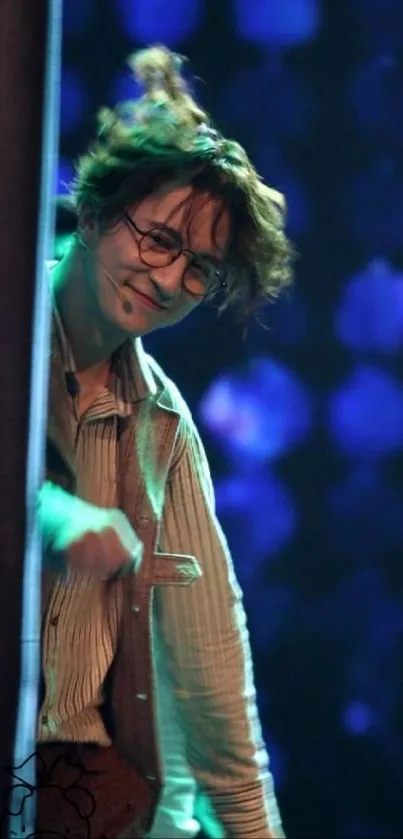 Joyful person in glasses with a charming smile under soft, glowing stage lights.