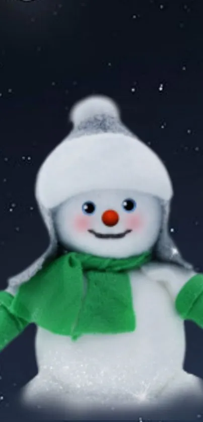 Snowman with green scarf under moonlit sky.