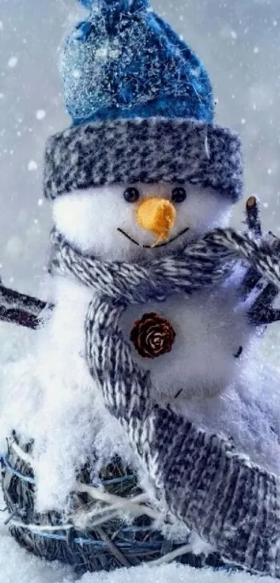 Snowman with a blue hat and scarf in a snowy winter scene.