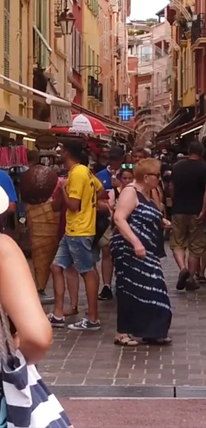 Crowded street market in European town with colorful shops and people.