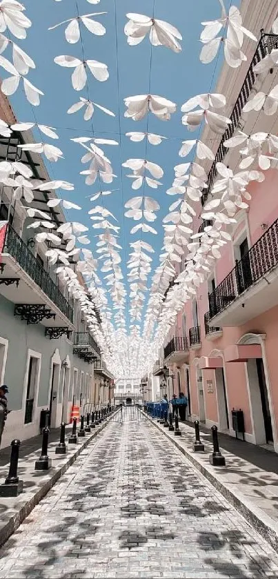 Colorful street with overhead decorations.