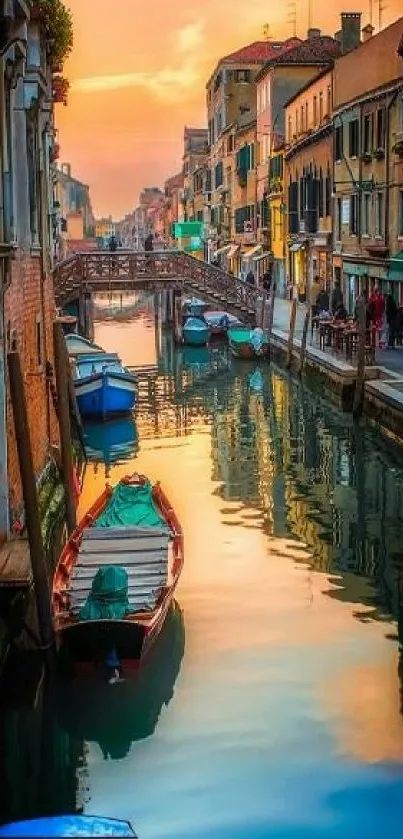 Enchanting Venice canal at sunset with colorful reflections and boats.