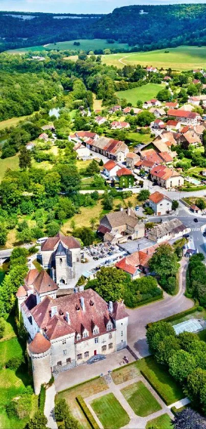 Aerial view of a charming village surrounded by lush green landscape.