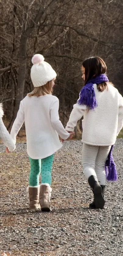 Children walking together on a serene winter path.