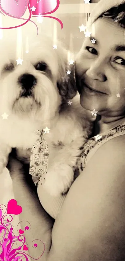 Smiling woman holding fluffy dog with pink hearts and stars.