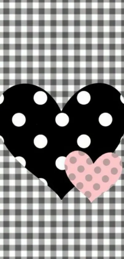 Checkered wallpaper with black and pink polka dotted hearts.