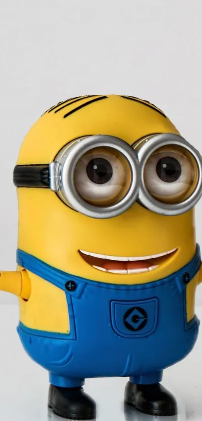 A cheerful yellow Minion with blue overalls, smiling broadly.