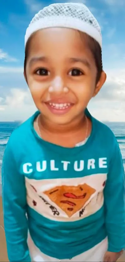 Smiling child in a blue shirt by the beach.