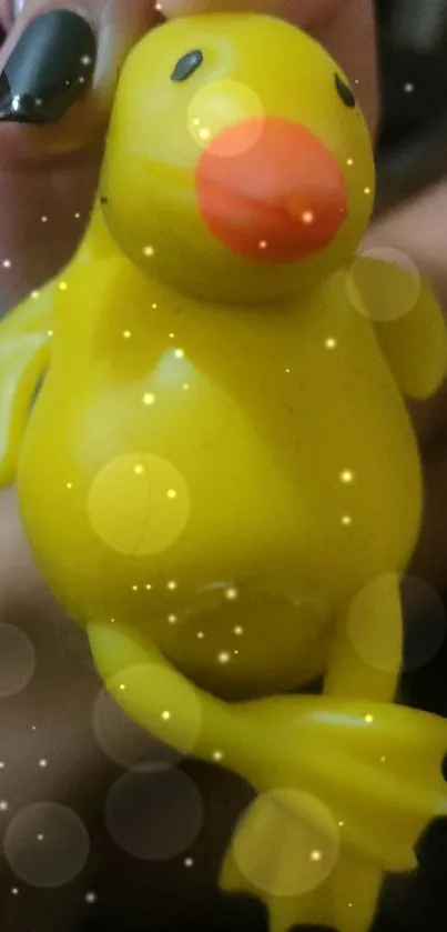 Yellow duckling toy with bubbles effect wallpaper.