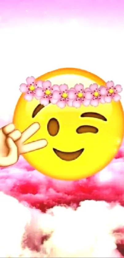 Cheerful emoji with floral crown over pink cloud background.