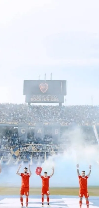 Football team celebrating with fans in a stadium.