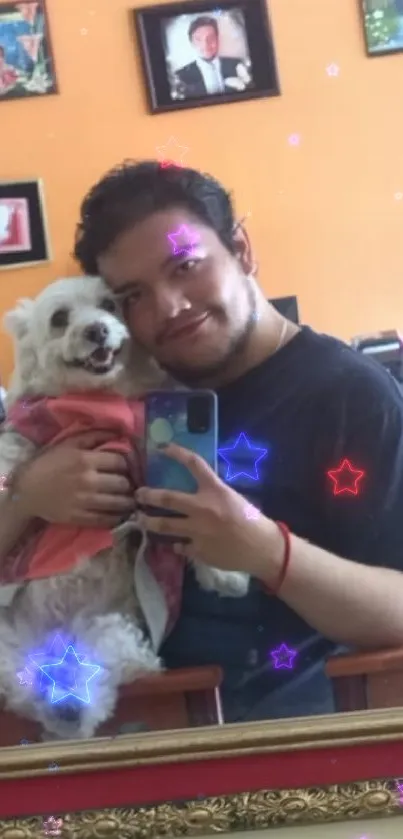 A person and dog taking a cheerful selfie in front of an orange wall.