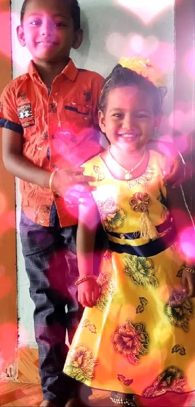 Smiling siblings in colorful outfits indoors.