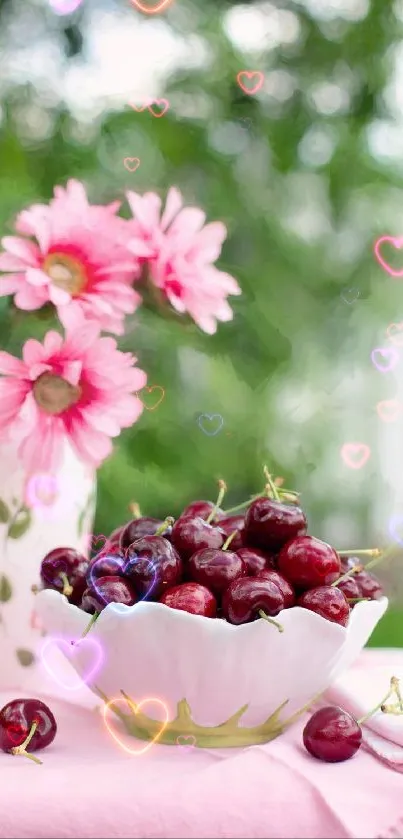 Bowl of cherries with pink flowers and heart accents in soft focus.