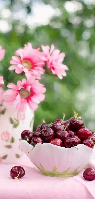 Cherries in bowl with pink flowers wallpaper scene.