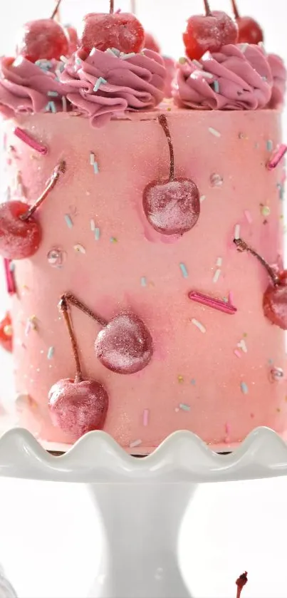 Pink cherry cake with sprinkles on a white stand.