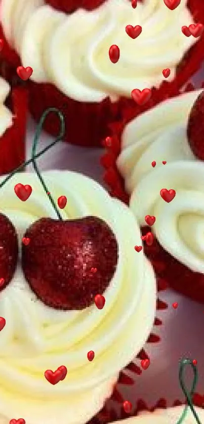 Cupcakes with creamy frosting and glittery red cherries on top.