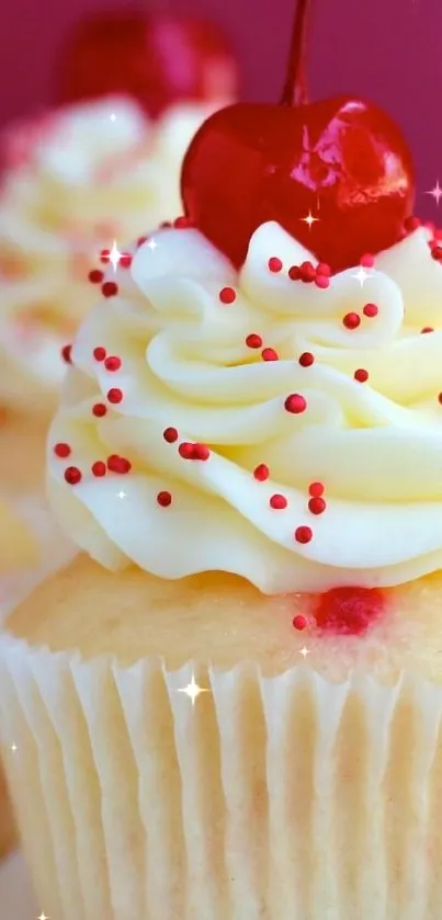 Cherry cupcake with creamy frosting and sprinkles.