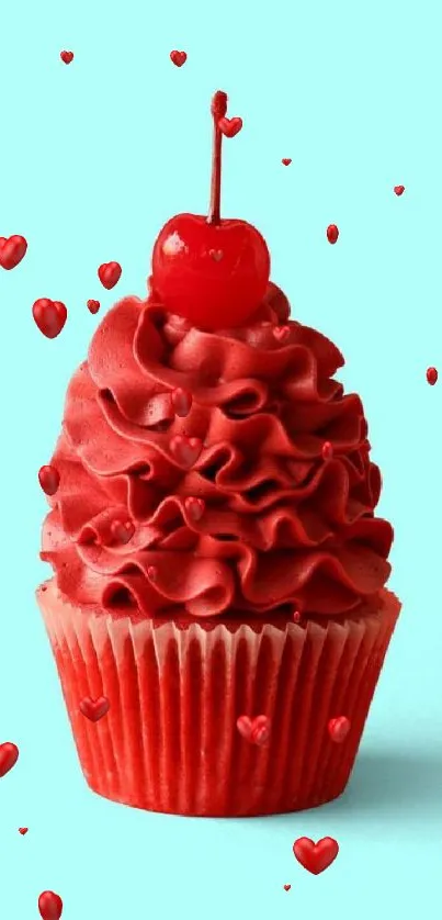 Red cupcake with cherry on aqua background.