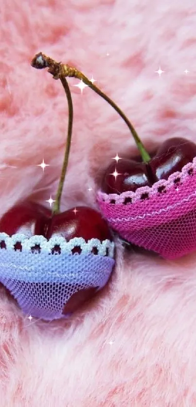 Two cherries in lace on pink fur background.