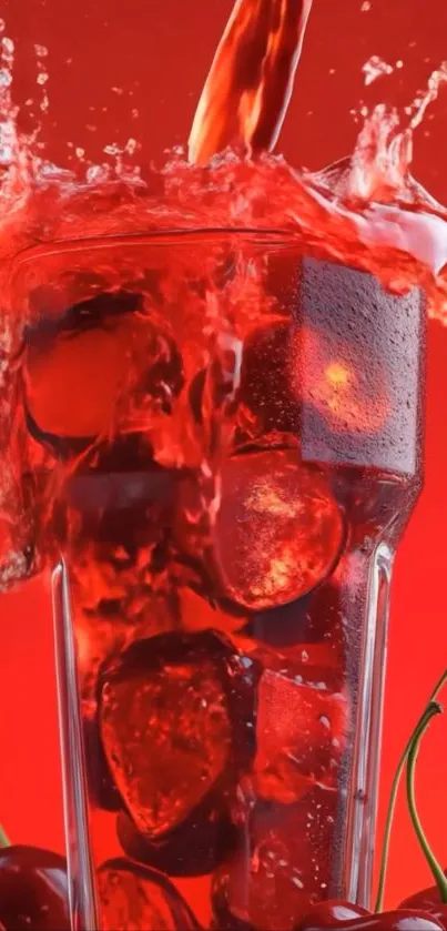 Glass of cherry juice with ice splashing vividly over a red background.