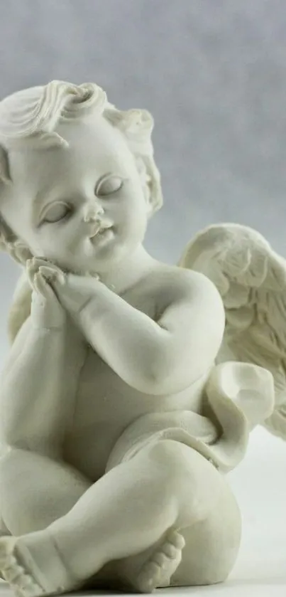 Serene cherub sculpture with angel wings mobile wallpaper.