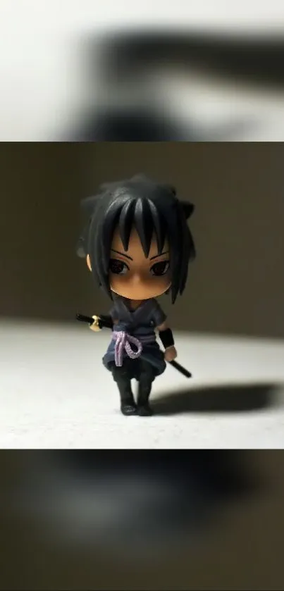 Chibi figure on dark gray background with soft lighting.