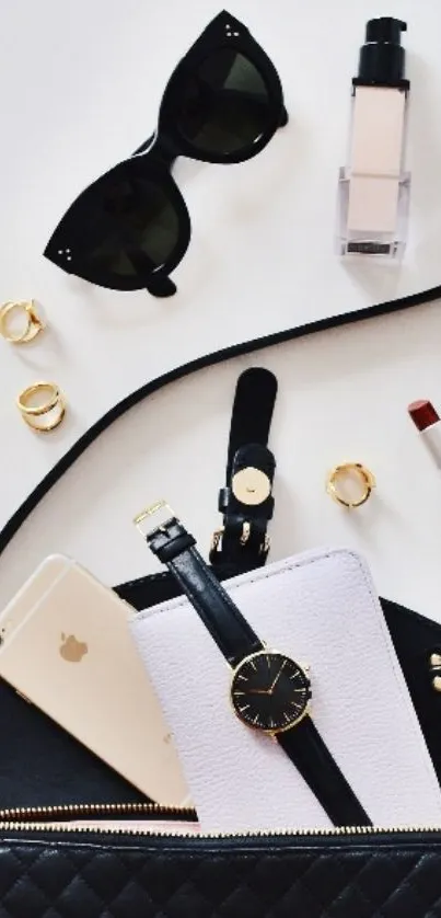 Chic flat lay of fashion essentials including phone and accessories.