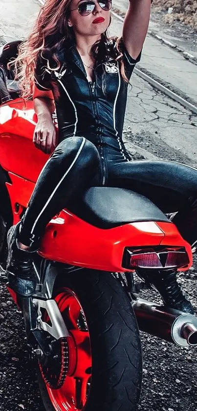 Woman in black leather on red motorcycle