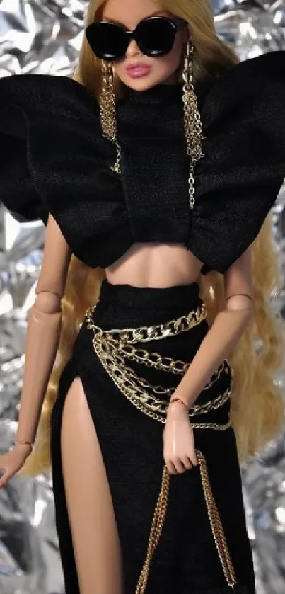 Fashion doll in black outfit with gold chains and sunglasses.