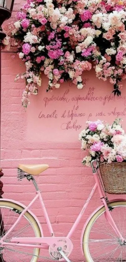 Vintage pink bicycle with floral basket on pink wall.