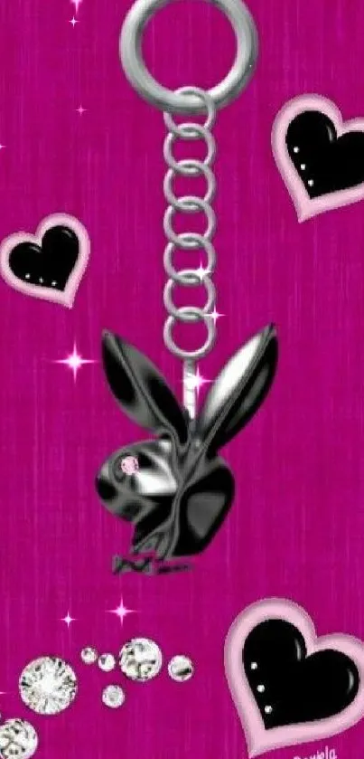 Black bunny keychain on pink heart background wallpaper.