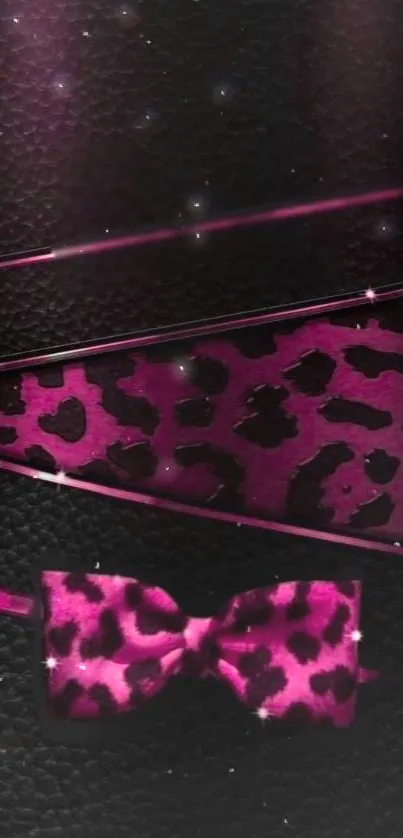 Chic leopard print wallpaper with pink glitter bow on a dark background.