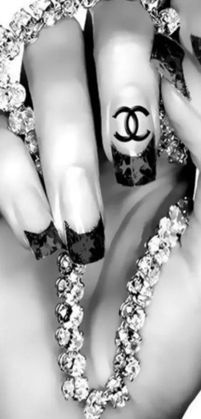 Chic mobile wallpaper with monochrome nail art and jewels.