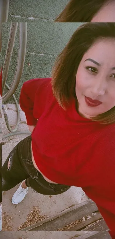 Woman in a red sweater posing outdoors.