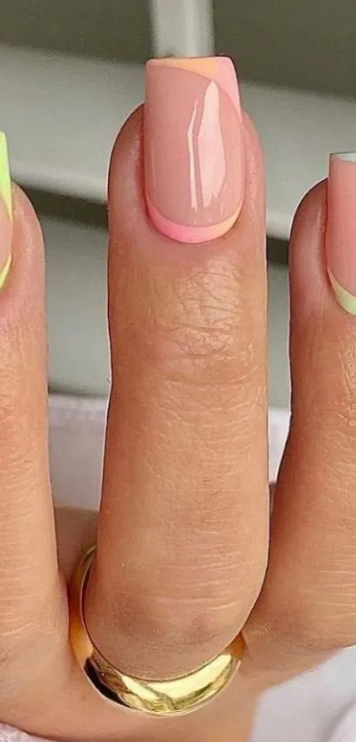 A hand with chic pastel nails and neon tips in soft colors.