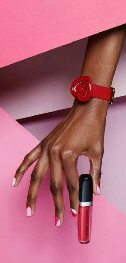 Stylish wallpaper with a hand holding a red accessory on a pink background.
