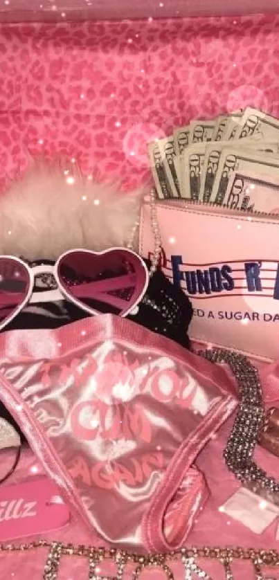 A pink glam box with fashion items and accessories.