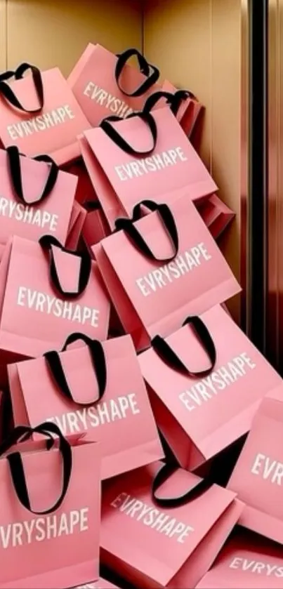 Pile of pink shopping bags in an elevator.