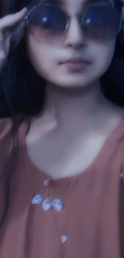 Chic portrait with sunglasses in brown attire.