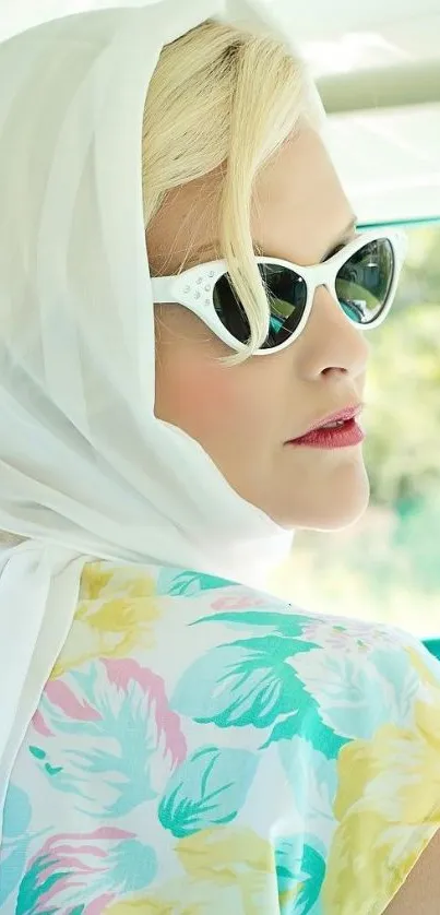 Chic woman in vintage floral dress and sunglasses, exuding retro summer style.