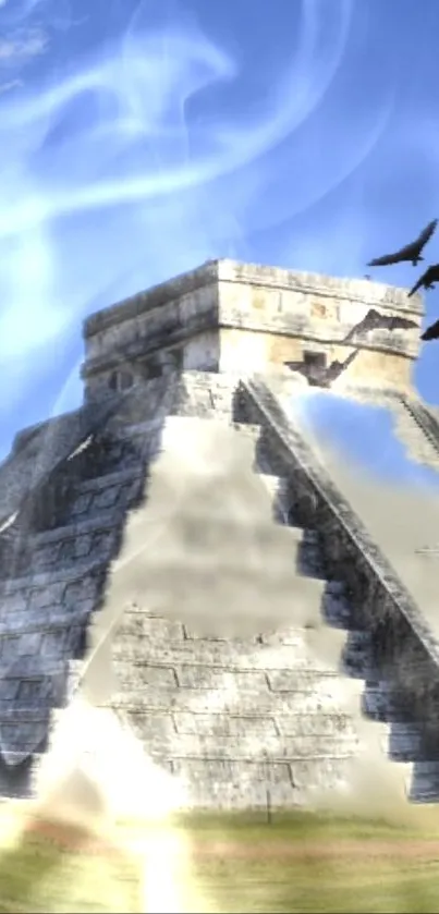 Chichen Itza pyramid under a clear blue sky with scattered clouds.