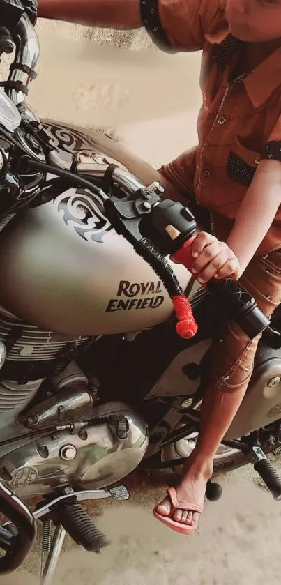 Child sitting on a Royal Enfield motorcycle.