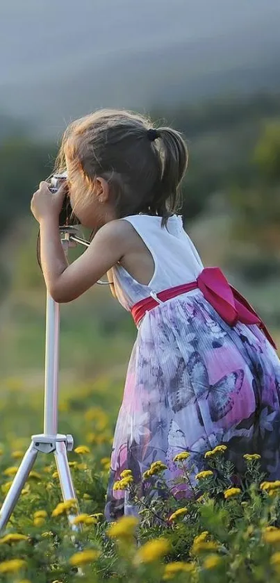 A young girl photographing nature with a camera in a field of yellow flowers.