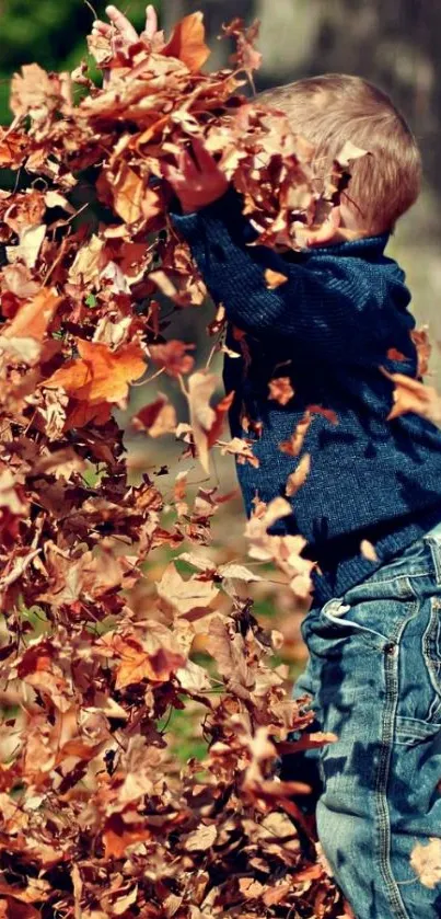 Child gleefully playing in a pile of autumn leaves outdoors.